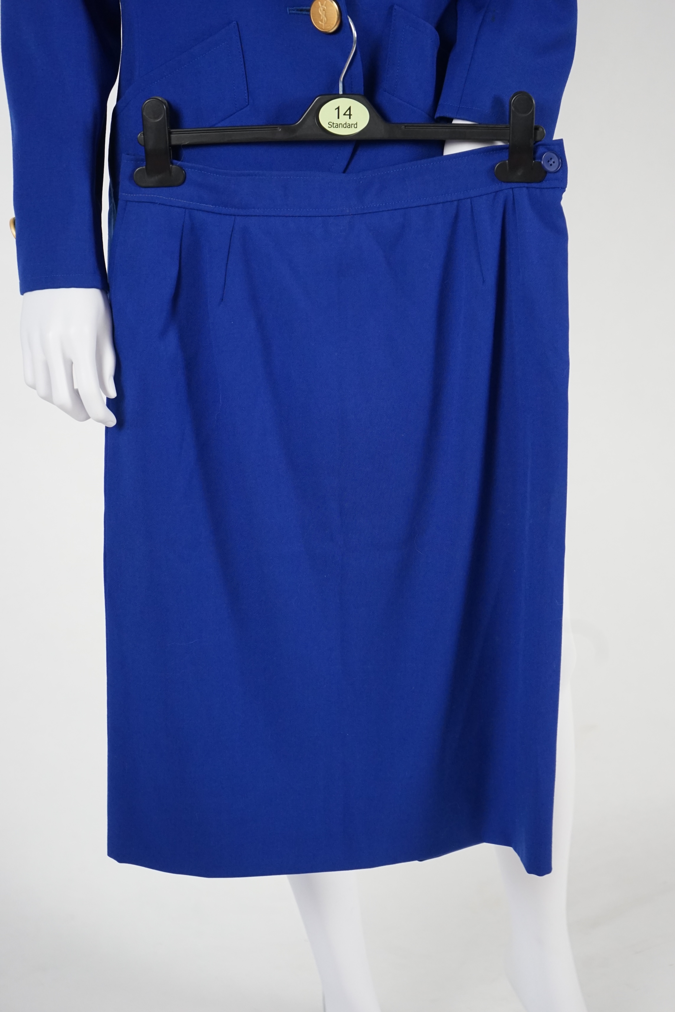 Two vintage Yves Saint Laurent variation lady's skirt suits, royal blue and orange. F 40 (UK 12).Please note alterations to make the waist smaller may have been carried out on some of the skirts. Proceeds to Happy Paws P